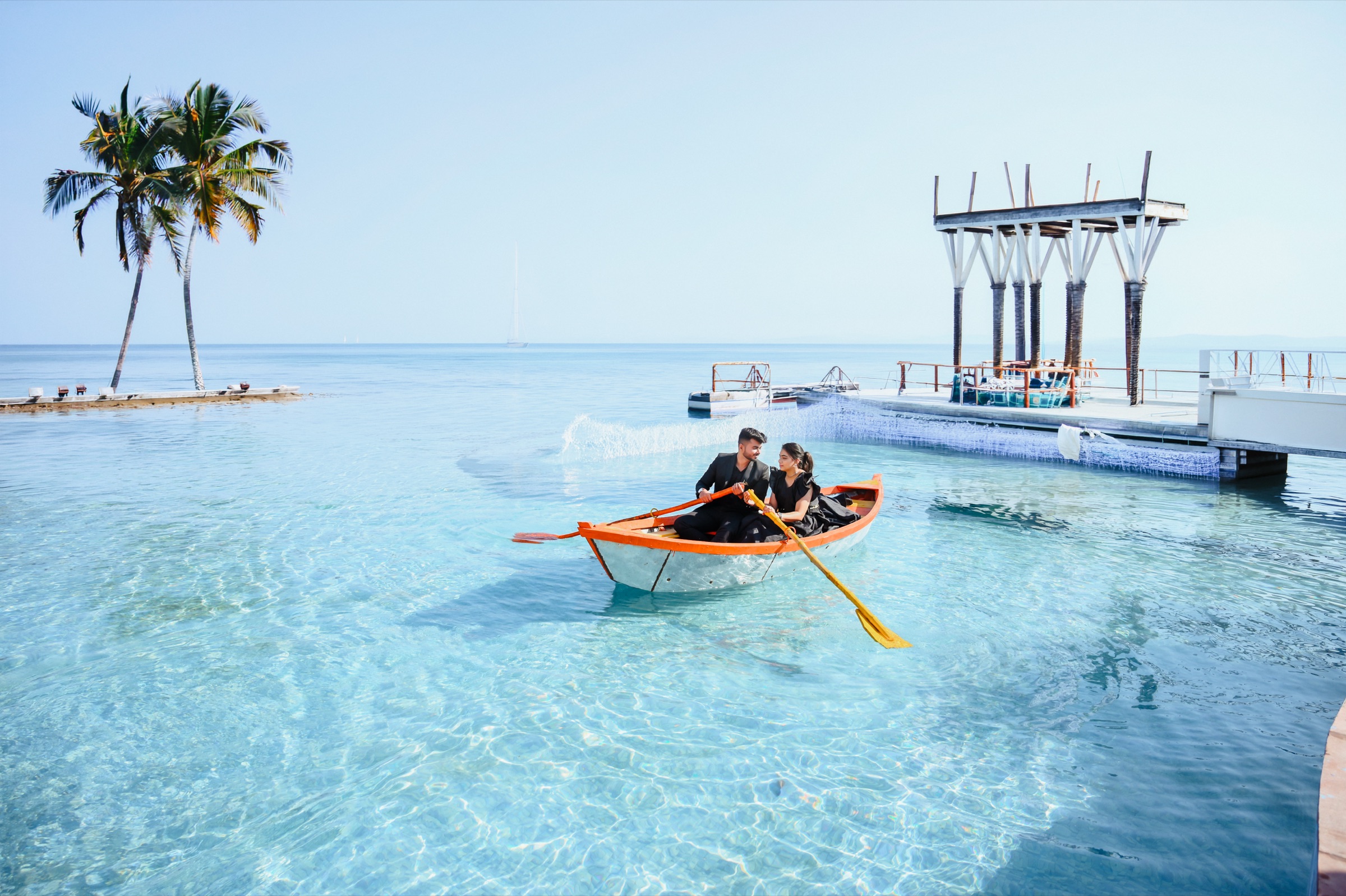 Pre-wedding couple on clear blue water